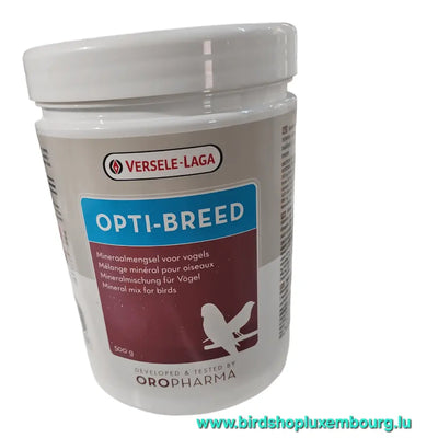 L'OPTI-BREED 500GR de Versele-Laga, doté d'une étiquette multilingue et d'un design de silhouette d'oiseau bleu-brun, affiche bien en évidence « birdshopluxembourg.lu » en bas pour les fans de Florastimul.